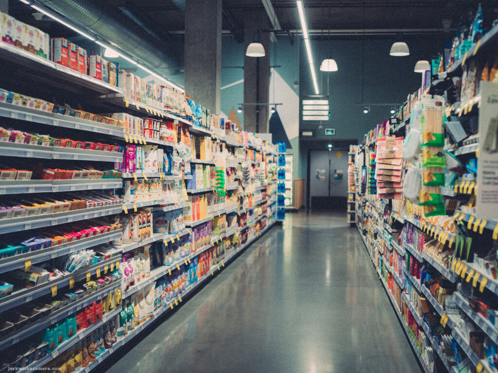 Shopper browsing through a grocery aisle captured through the lens of a Hasselblad 503CXI with a 100 megapixel CFV 100 digital back and Carl Zeiss Distagon T* 60mm F/3.5 CB Lens.