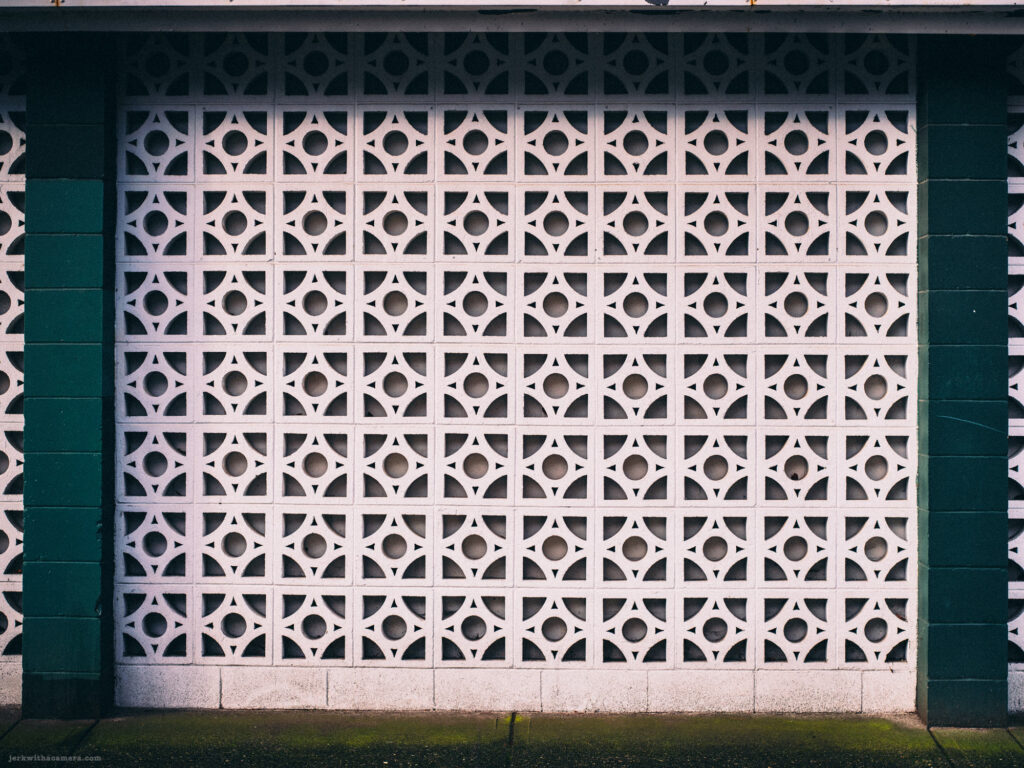 Close-up of a mid-century modern concrete block pattern on a building facade.
