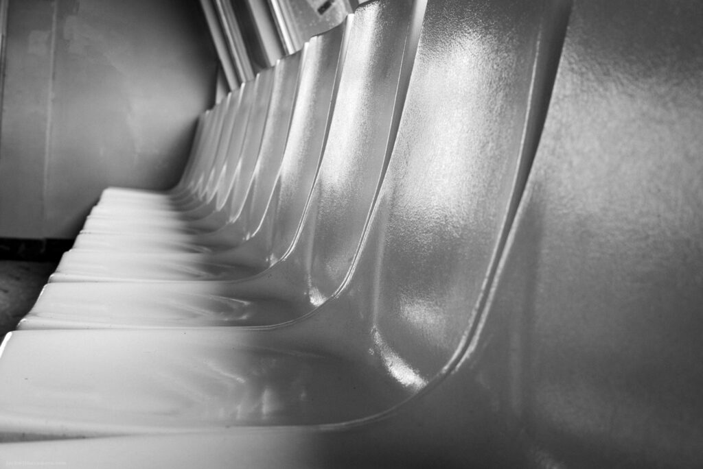 Row of empty plastic seats inside the SeaBus