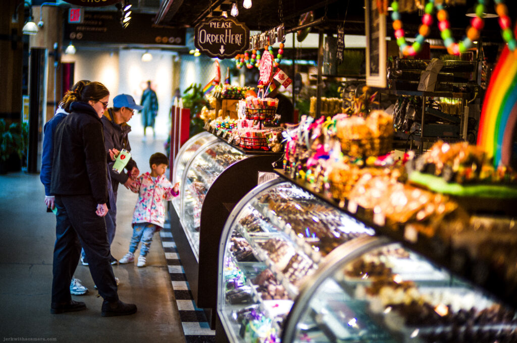 Group of people shopping at a candy counter, taken with a Leica M-D Typ 262 and the Light Lens Lab 50mm f/1.2 ASPH "1966” lens