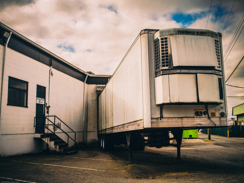 Reefer trailer parked at an industrial loading dock