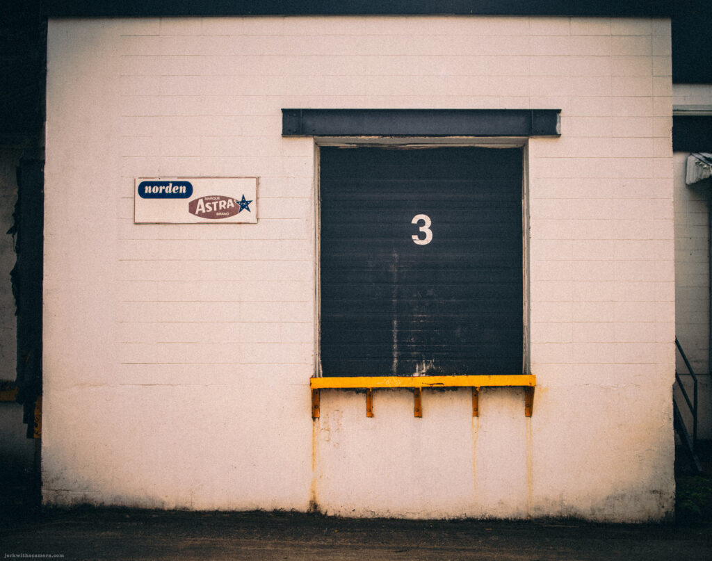 Loading dock door with Astra brand signage