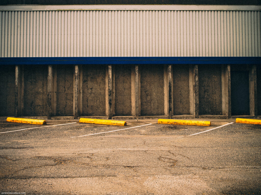 Empty parking lot with yellow parking blocks