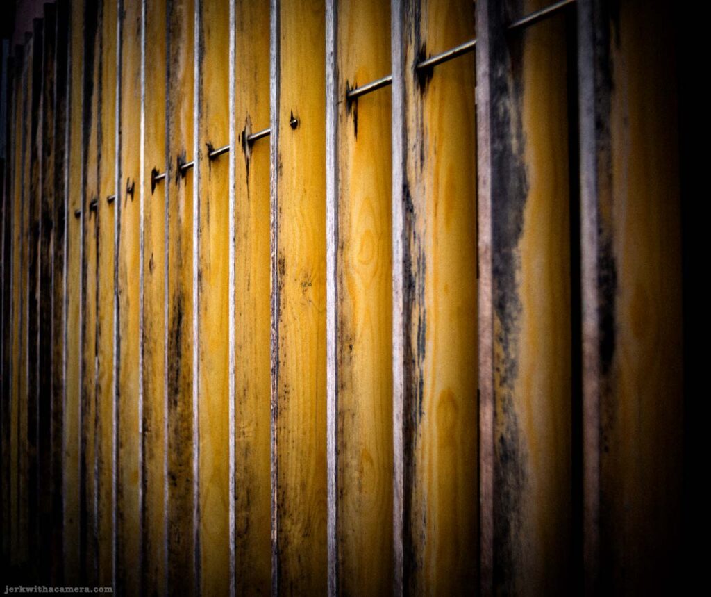 Wood panel with vertical slat pattern on Commercial Drive in Vancouver