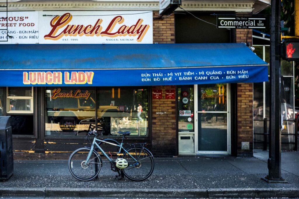Bicycle parked outside Lunch Lady restaurant on Commercial Drive in Vancouver