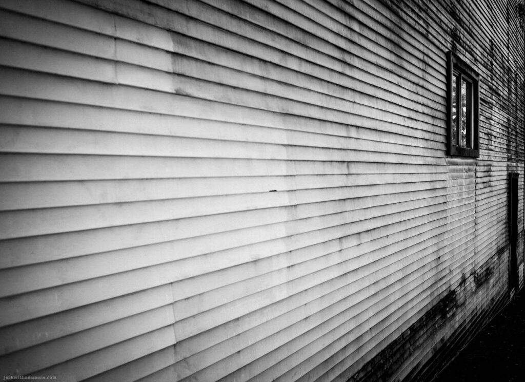 Vinyl siding with window on Commercial Drive in Vancouver